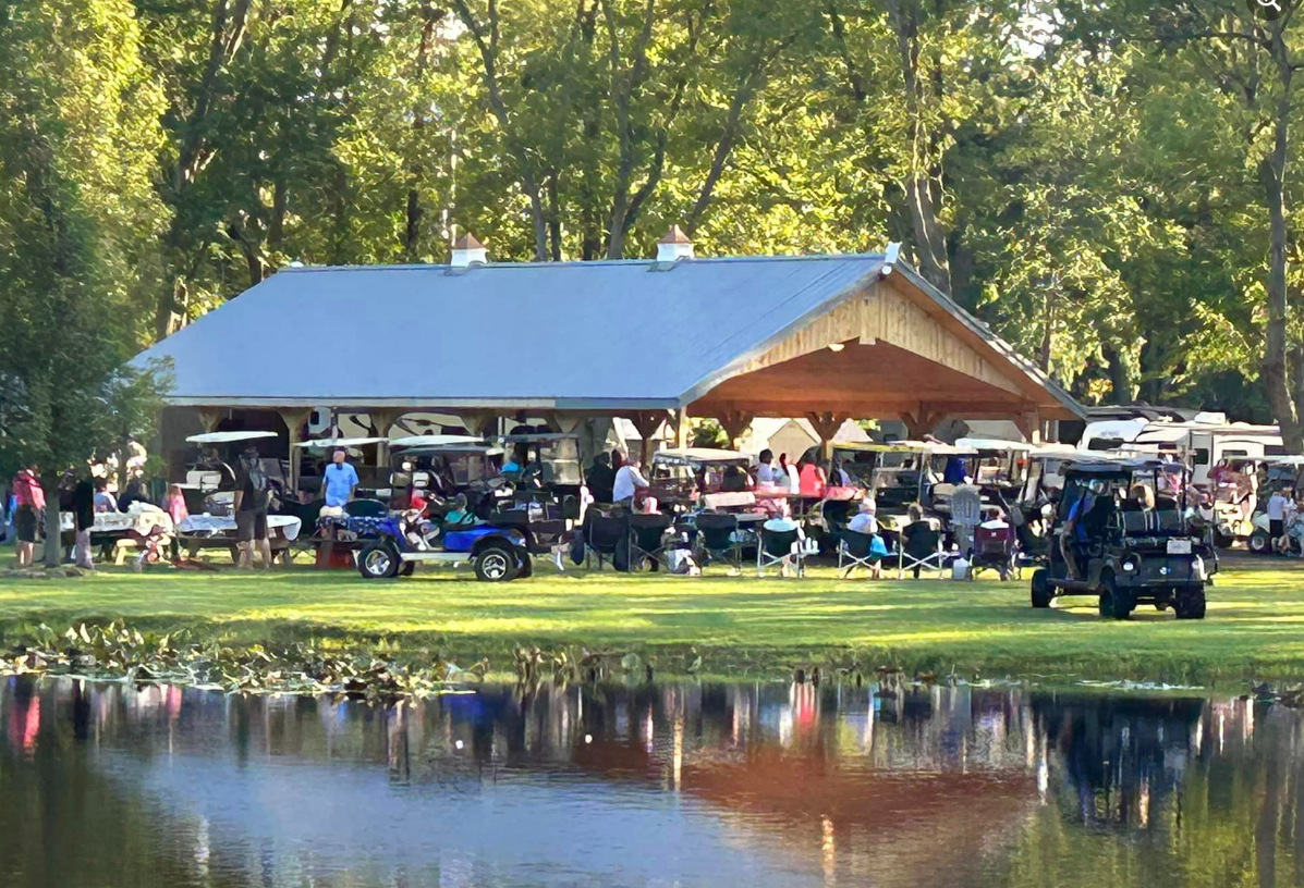 willow lake campground visitors attending a potluck being held under a large pavilion